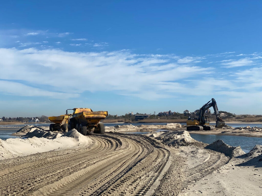 dredging a pond by hand